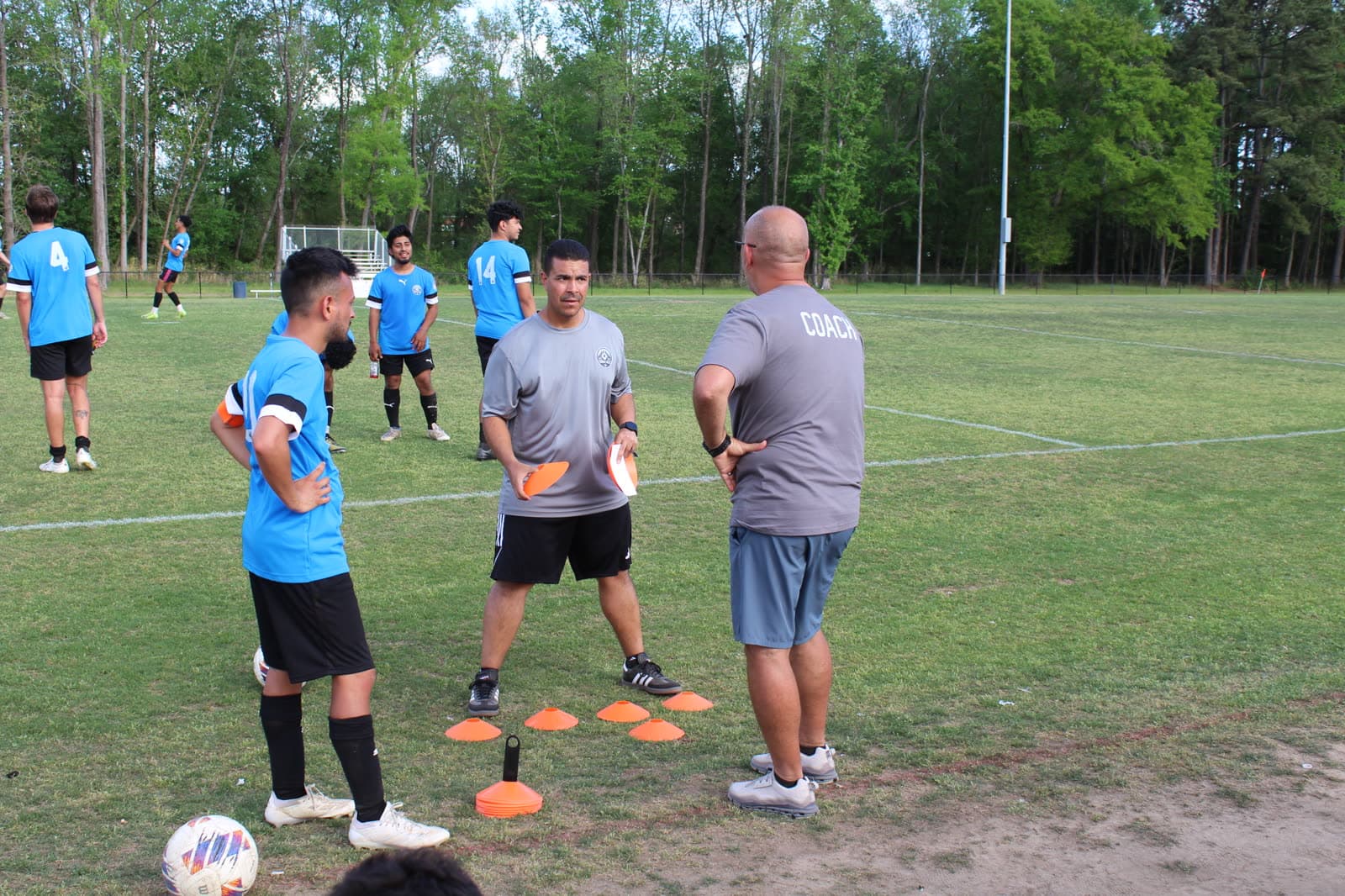 Alex coaching a youth training session