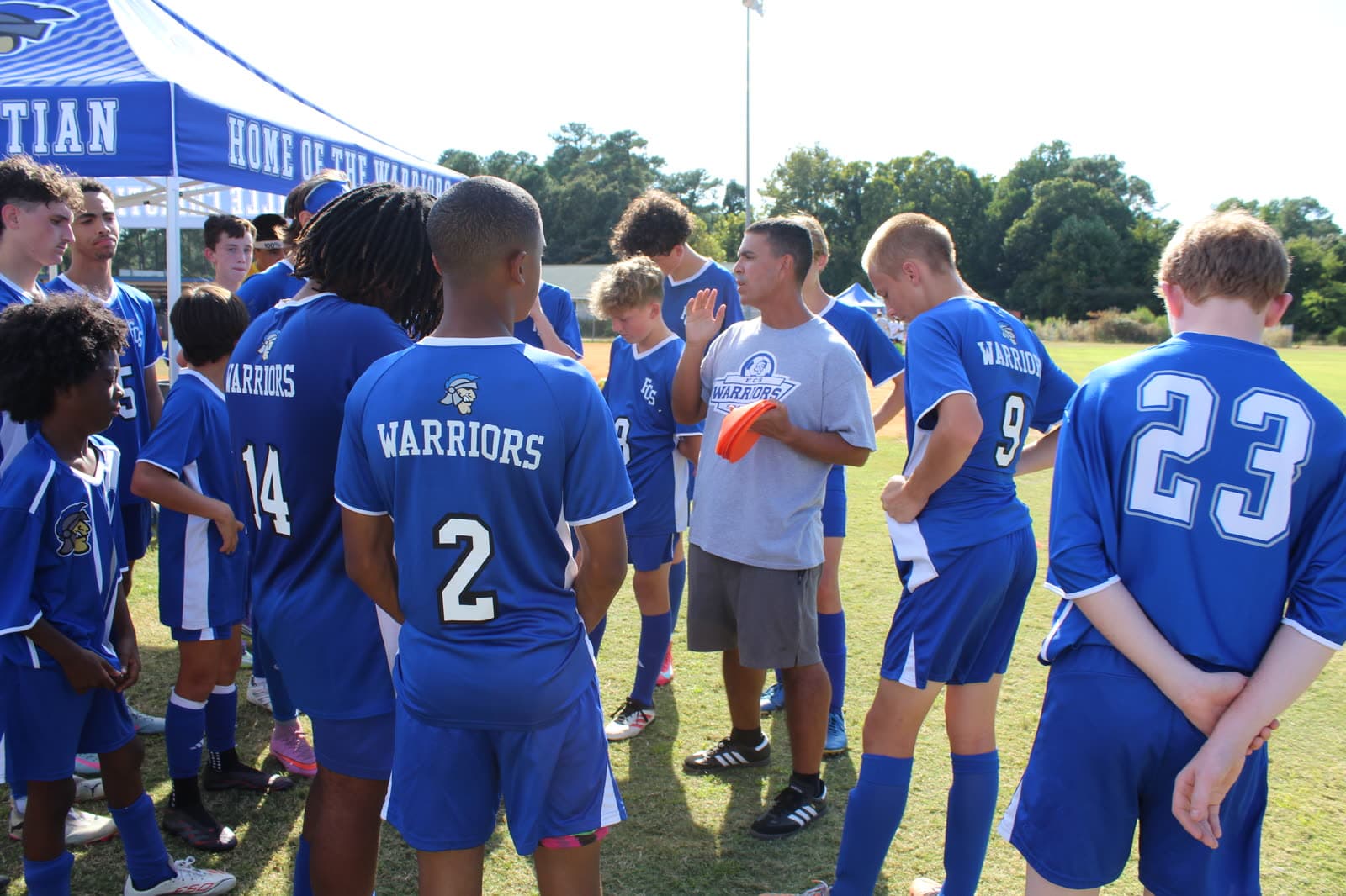Alex leading a team huddle during a match