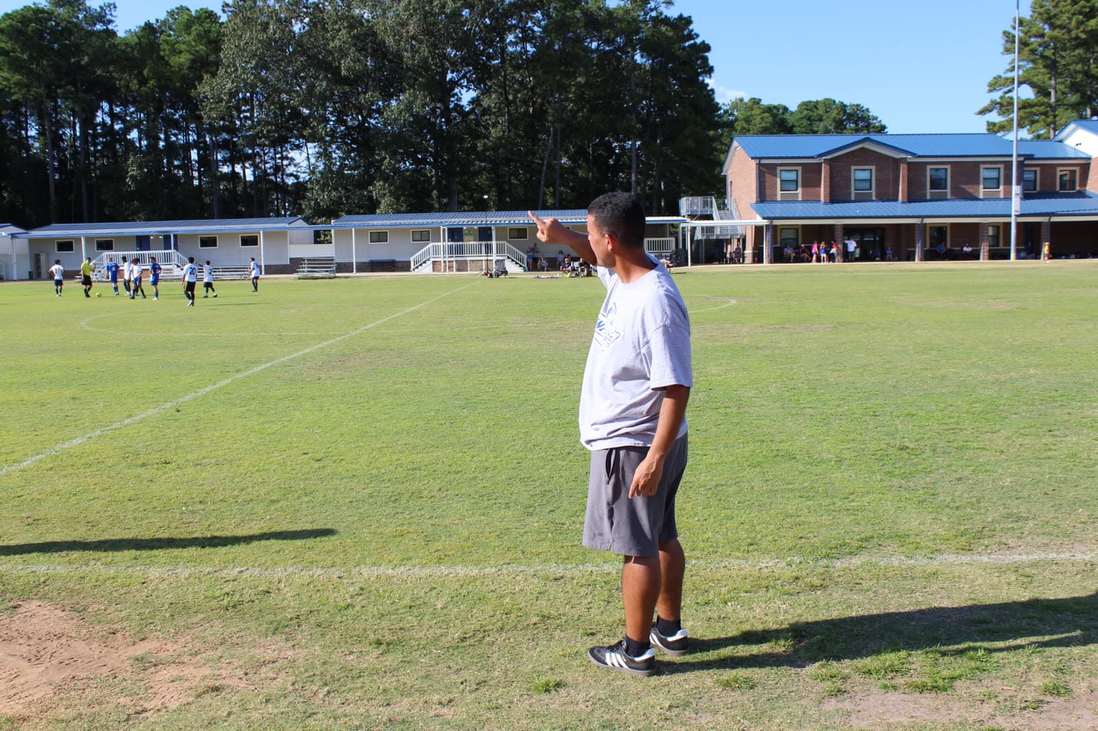 Players and coach on the field
