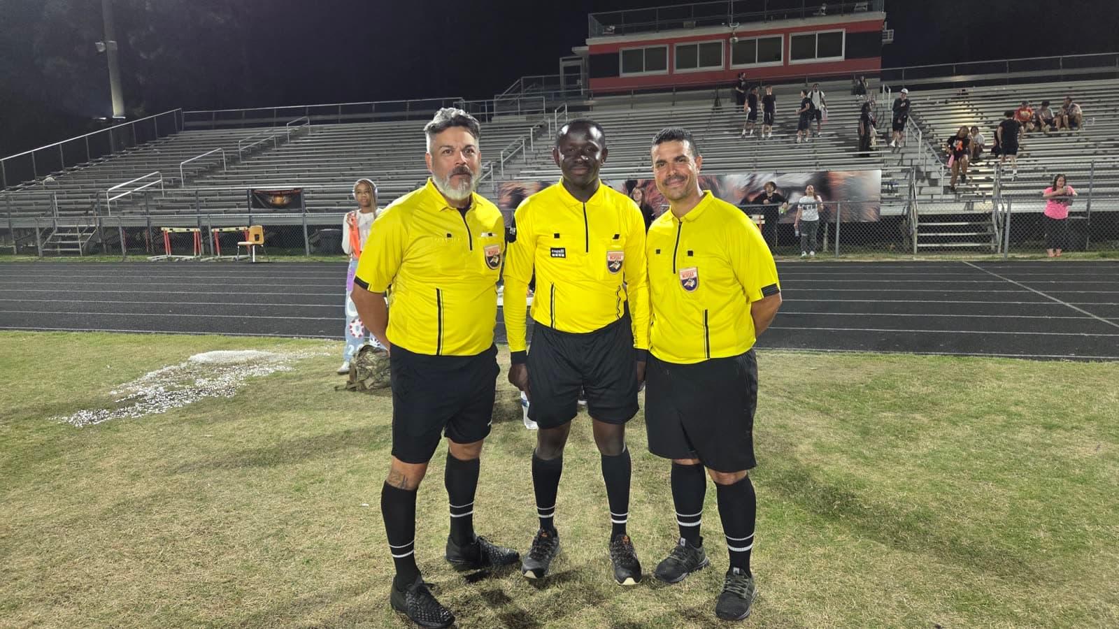 Referee crew on the field at a stadium