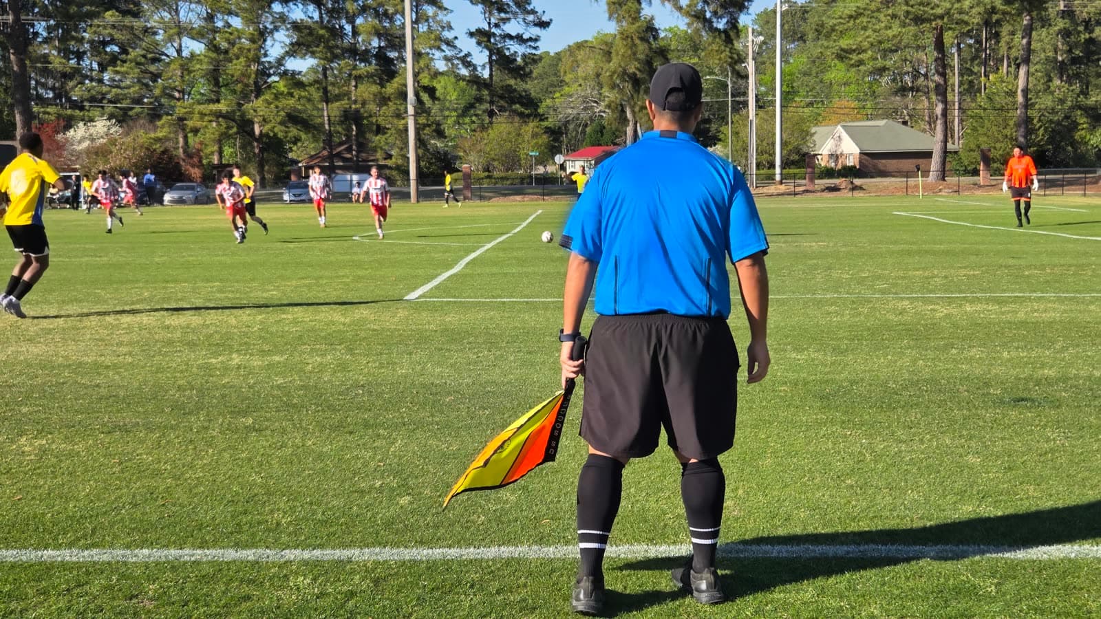 Alex with the referee crew before a match