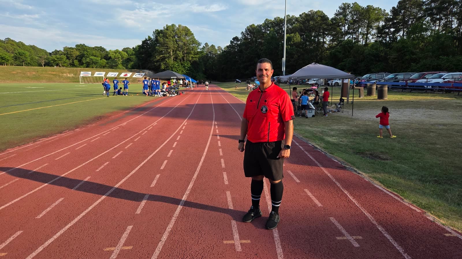 Alex officiating at a track venue